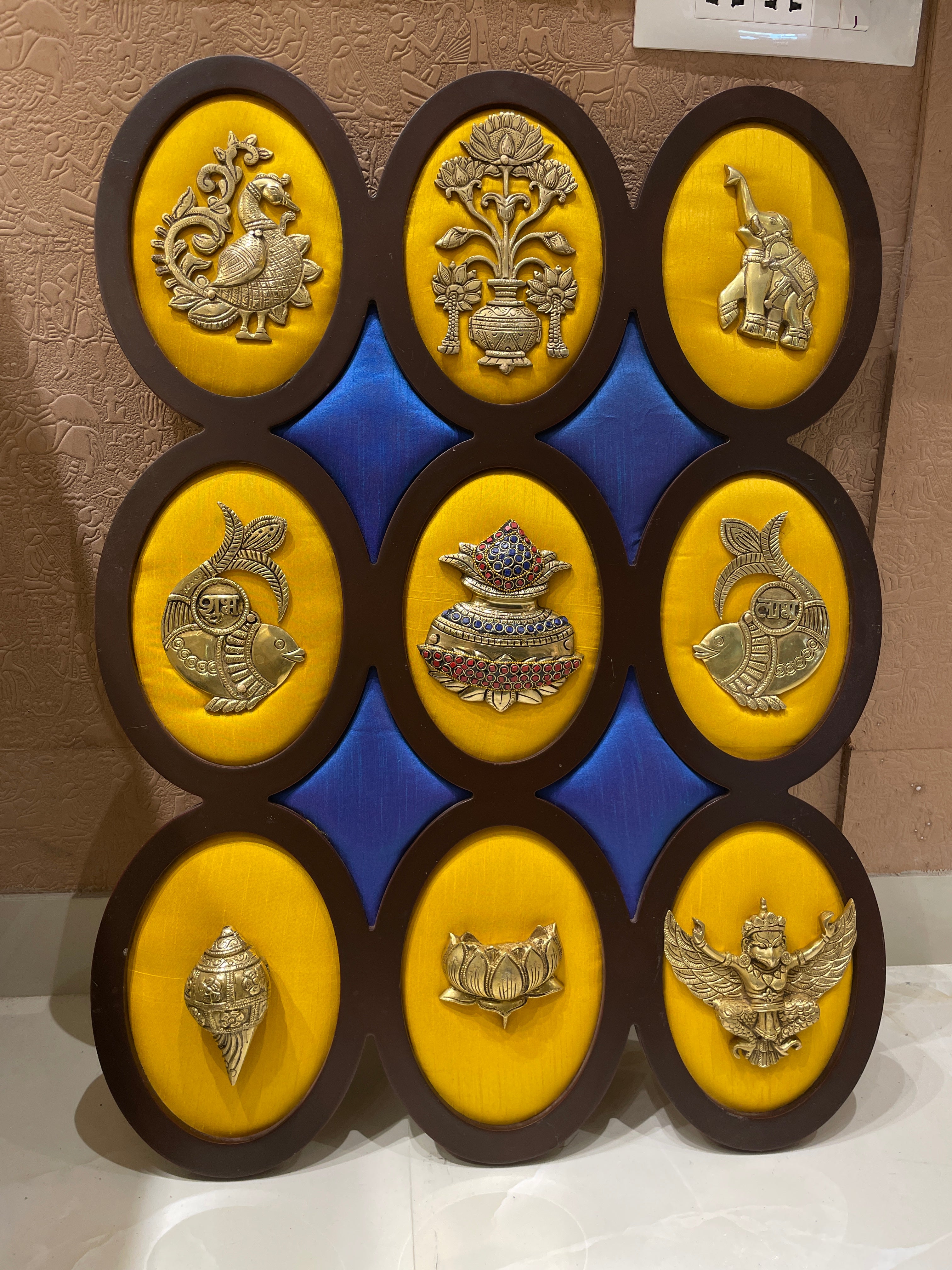 9 Brass Auspicious Symbols On Yellow Silk Wall Art Set.