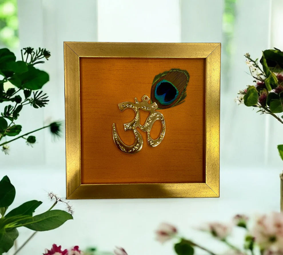 Brass Om with peacock feather & wine red silk in Gold frame