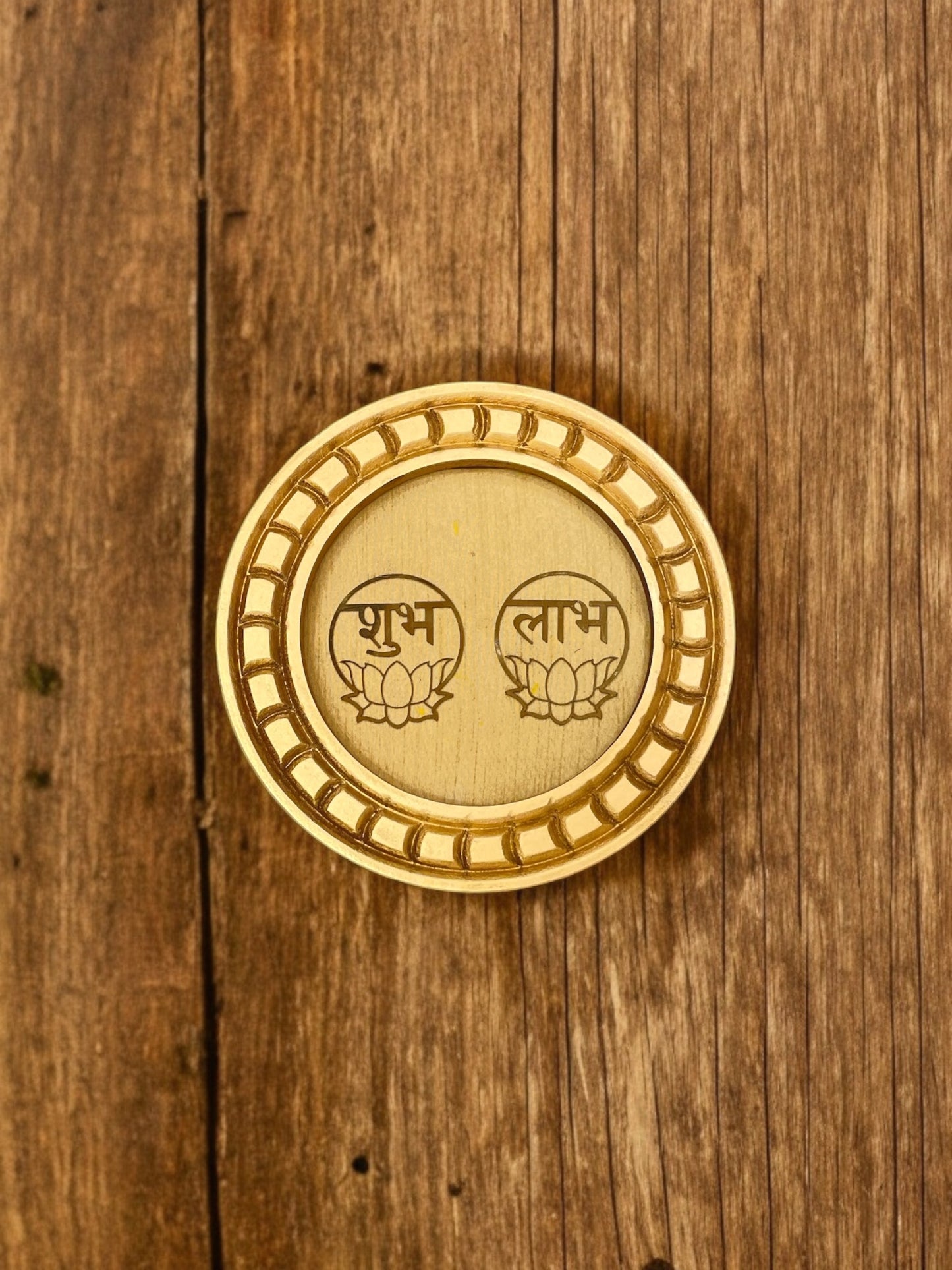 Shubh Labh Golden circular frame with beige backdrop