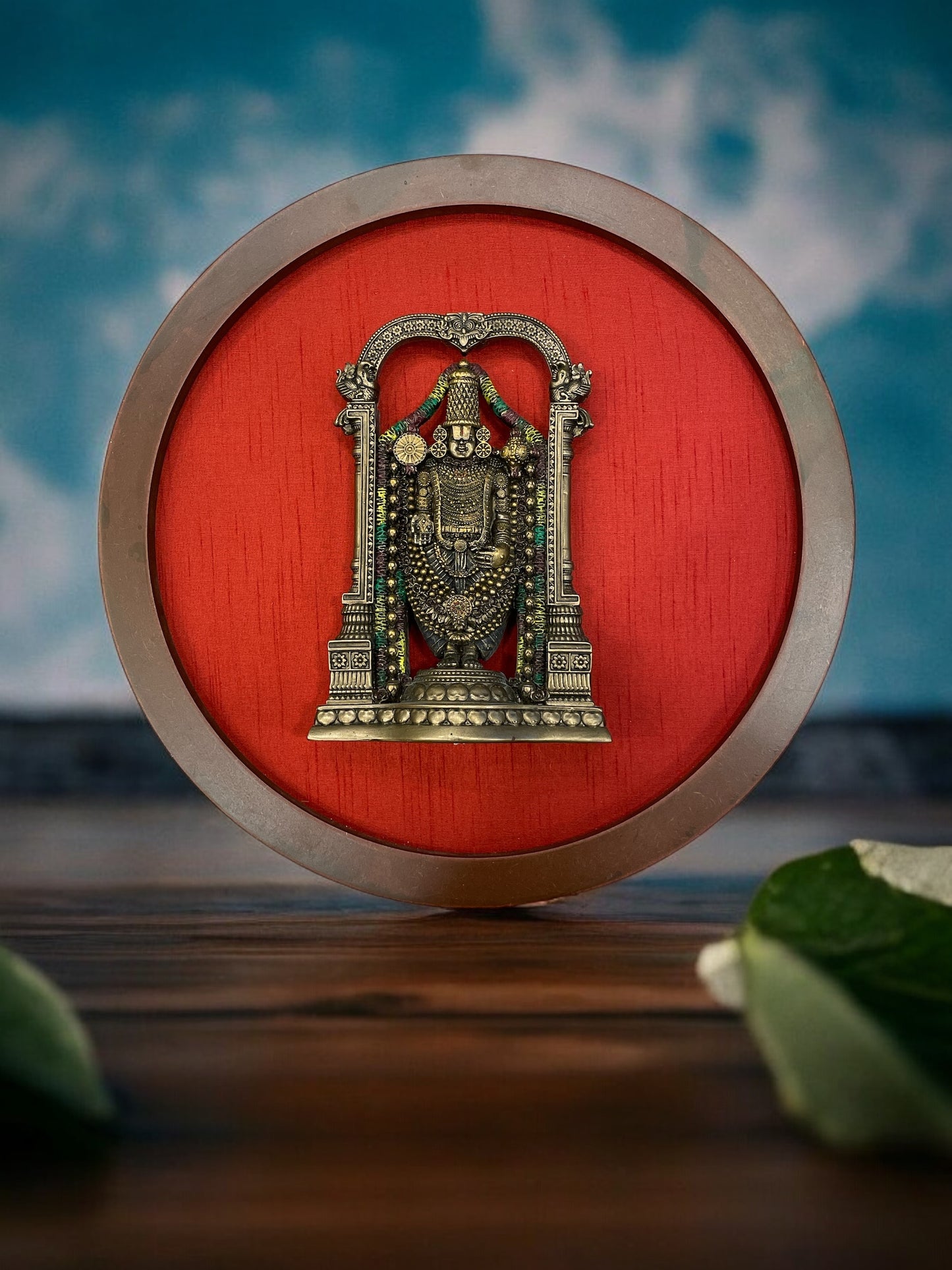 Bronze Venkateshwara Swamy Idol In a Circle Frame With Wine red Silk Background