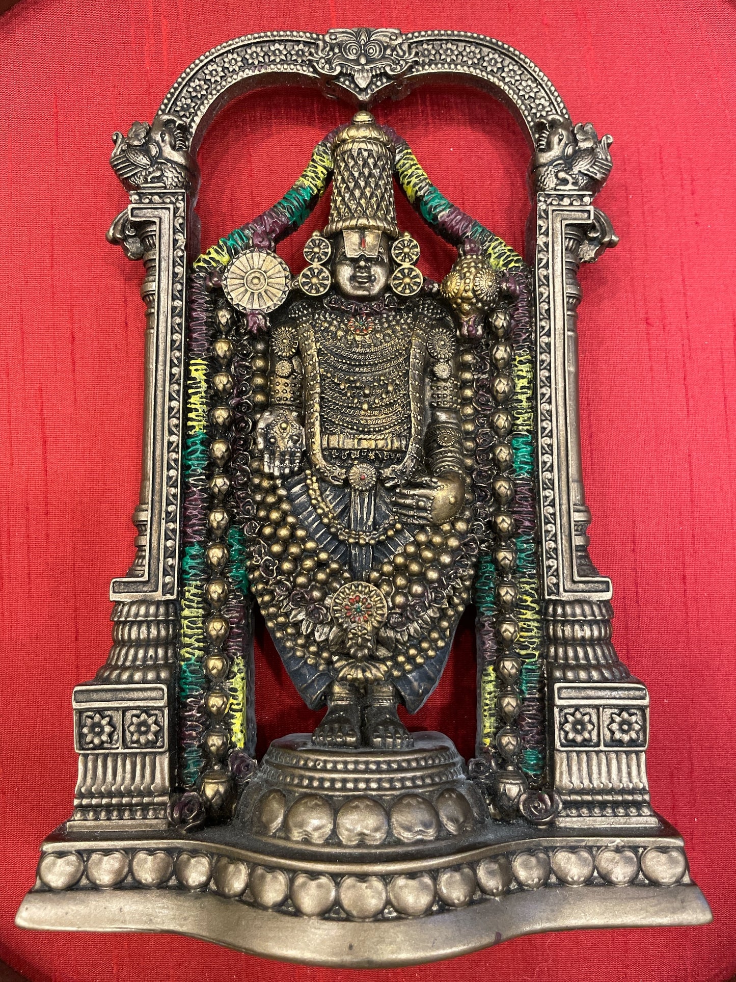 Bronze Venkateshwara Swamy Idol In a Circle Frame With Wine red Silk Background