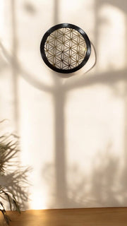 Titanium Flower of Life within a Circular wooden Frame
