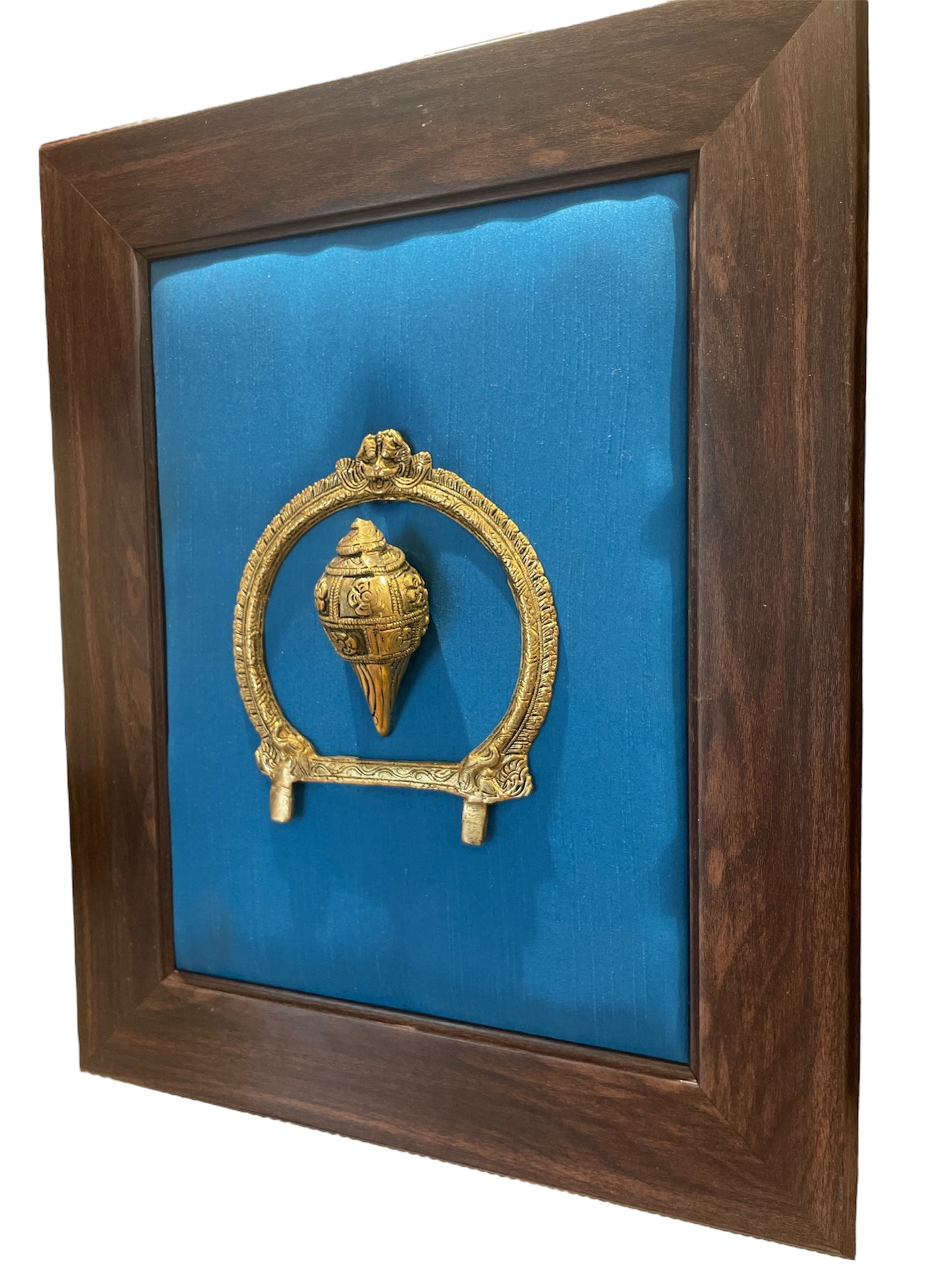 Brass Conch and Prabavali with Blue Cushion Backdrop in Brown frame