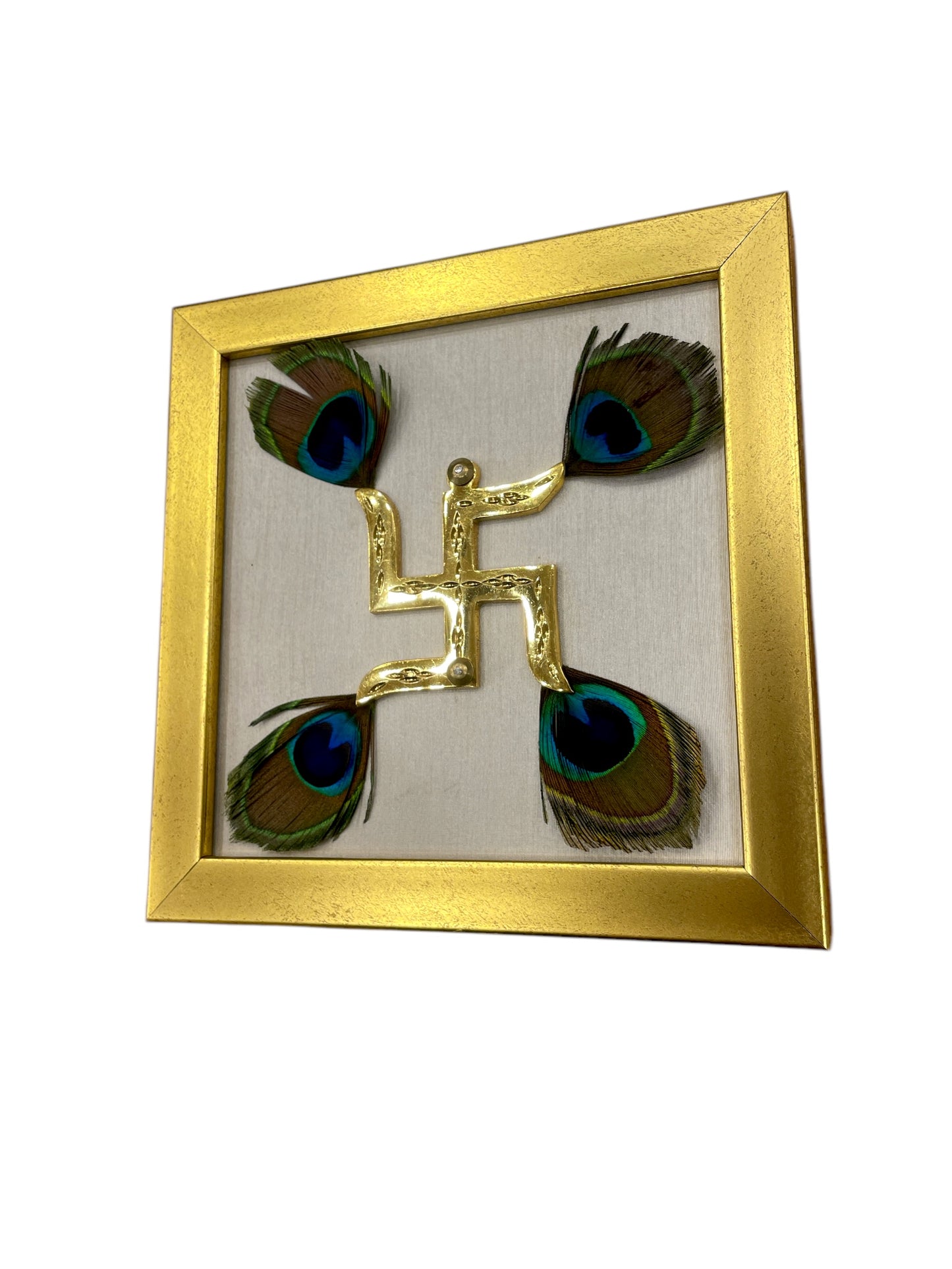 Brass Swastik with Peacock Feathers & Off white silk in gold frame