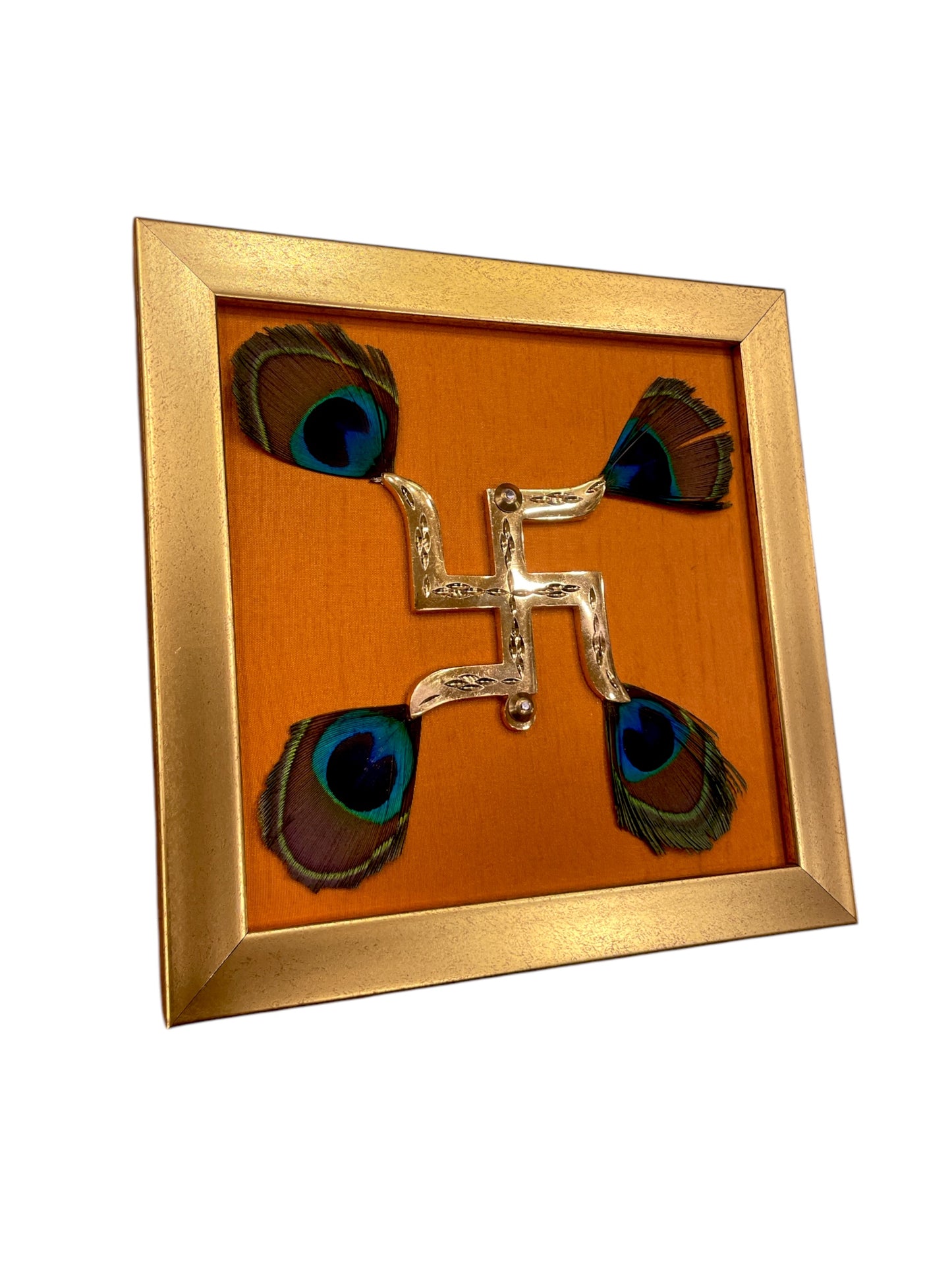 Brass Swastik with Peacock Feathers & Orange Silk in Gold frame