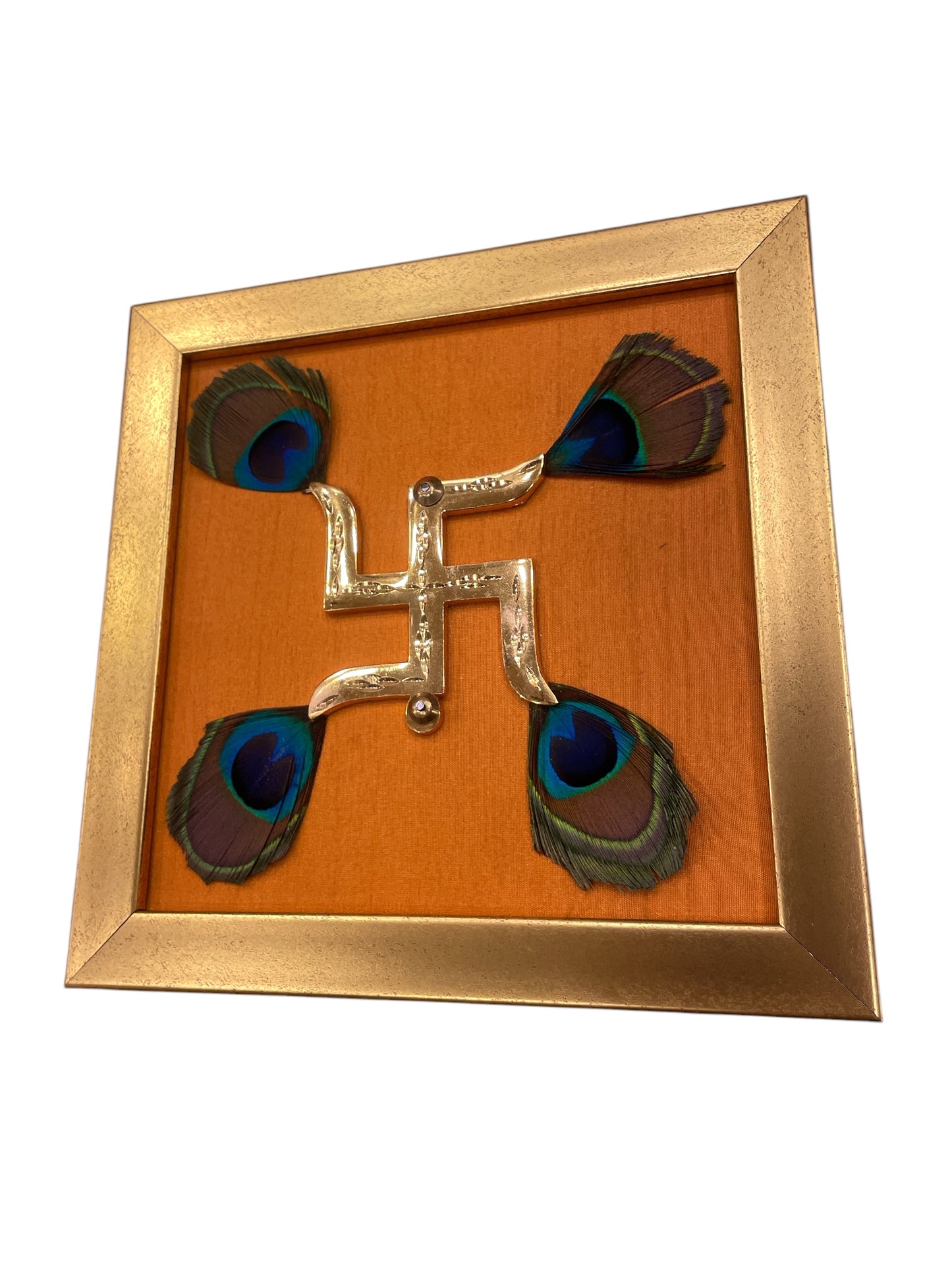 Brass Swastik with Peacock Feathers & Orange Silk in Gold frame