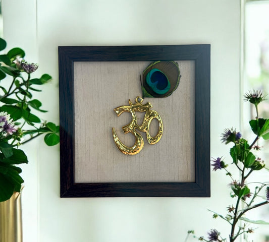 Brass Om With Peacock Feather & white Silk in Brown Frame