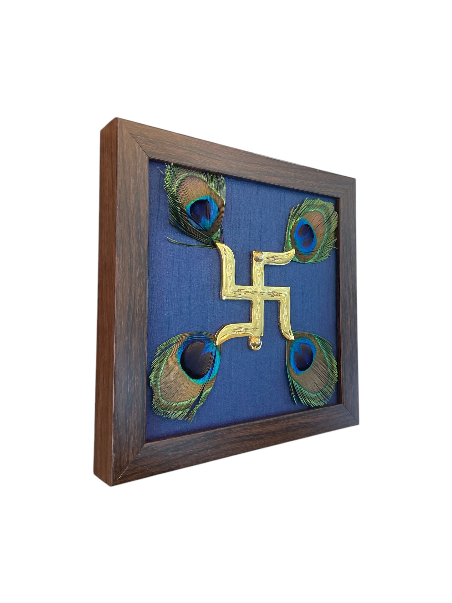 Brass Swastik with Peacock Feather and Blue silk in Brown Frame