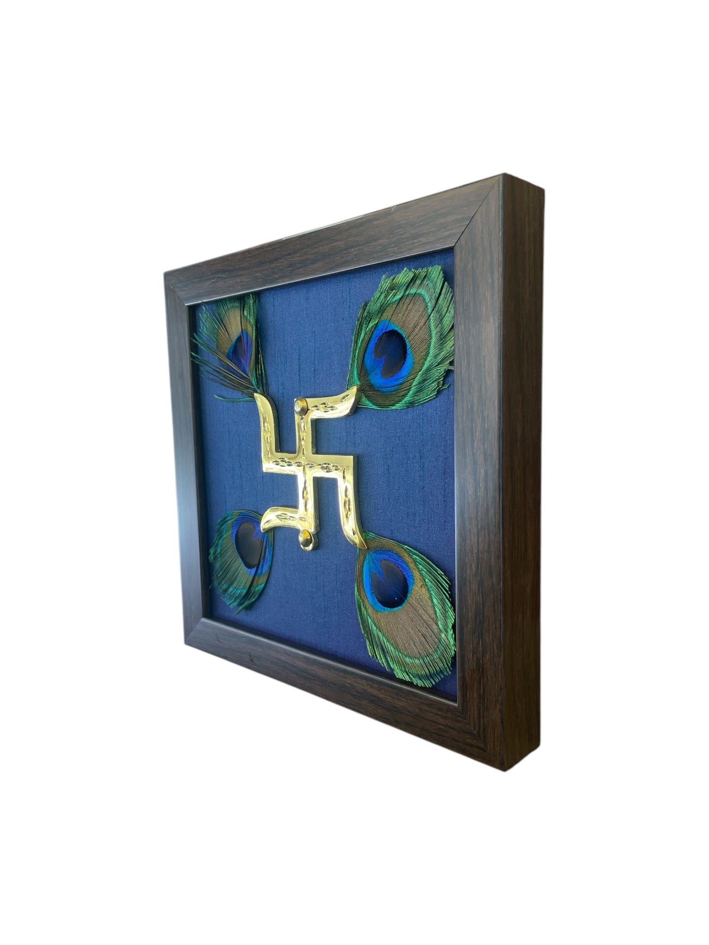 Brass Swastik with Peacock Feather and Blue silk in Brown Frame