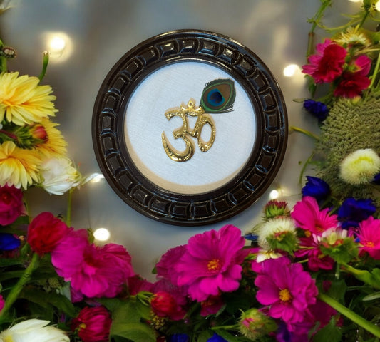 Brass Om with peacock feather & white silk Backdrop in Wooden frame