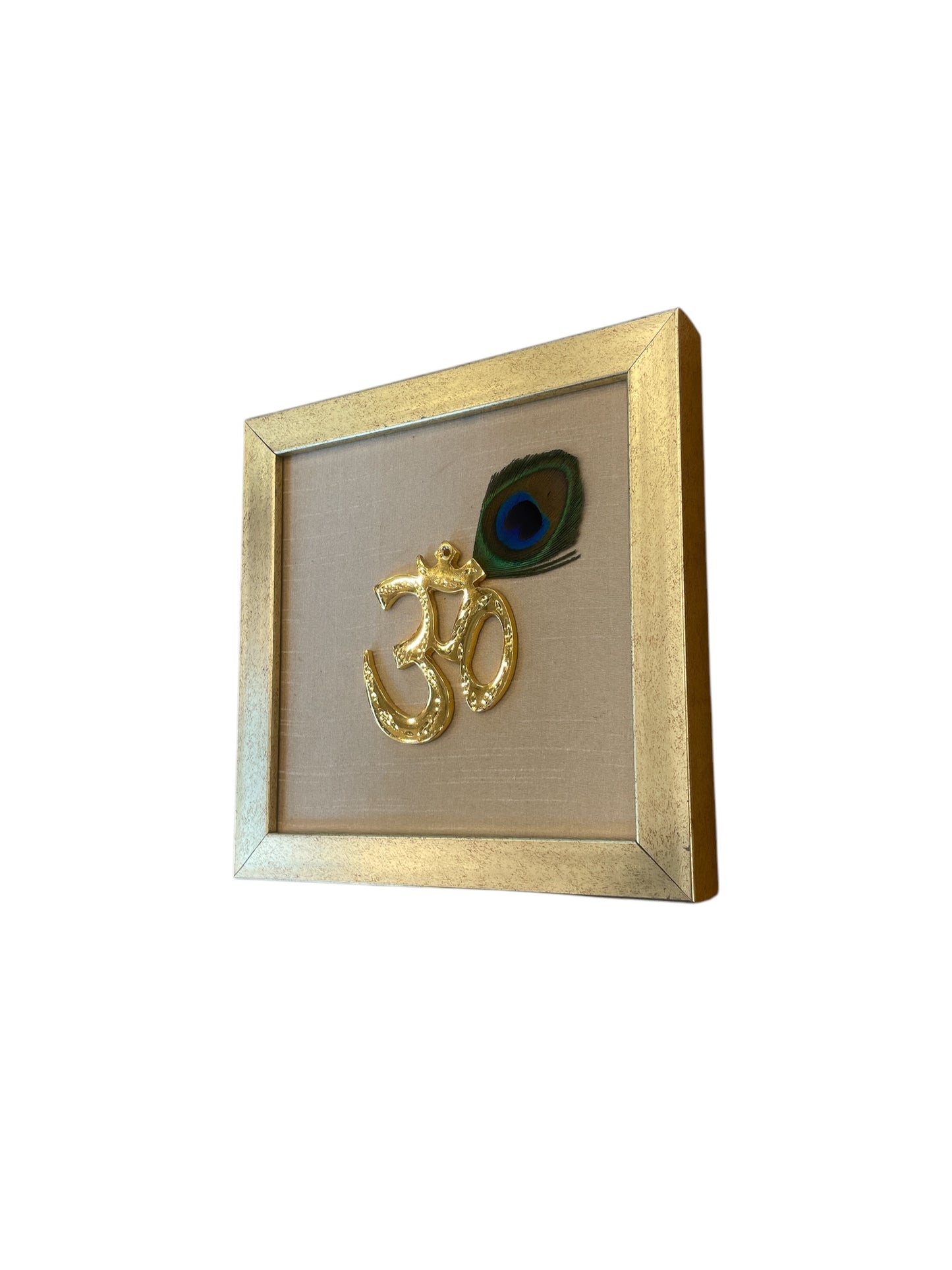 Brass Om with peacock Feather& white silk in Antique gold frame