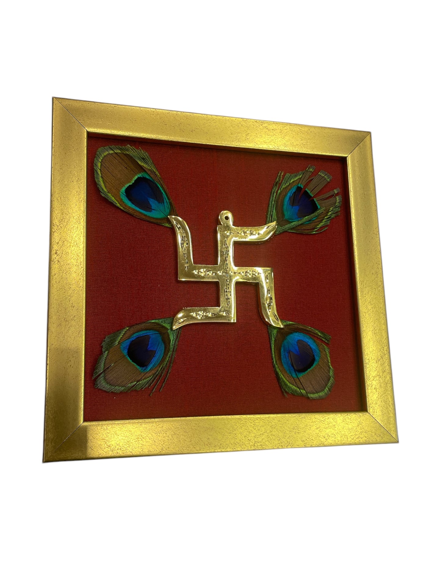 Brass Swastik with peacock feather & wine red silk in Gold frame