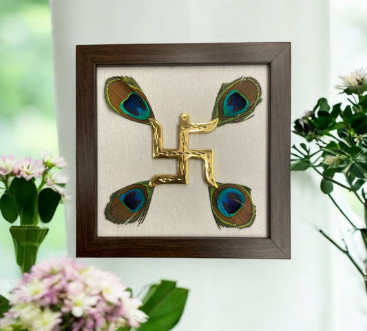 Brass swastik with peacock feather & white silk in Brown frame