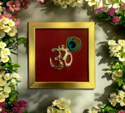 Brass Om with peacock feather & wine red silk in Gold frame