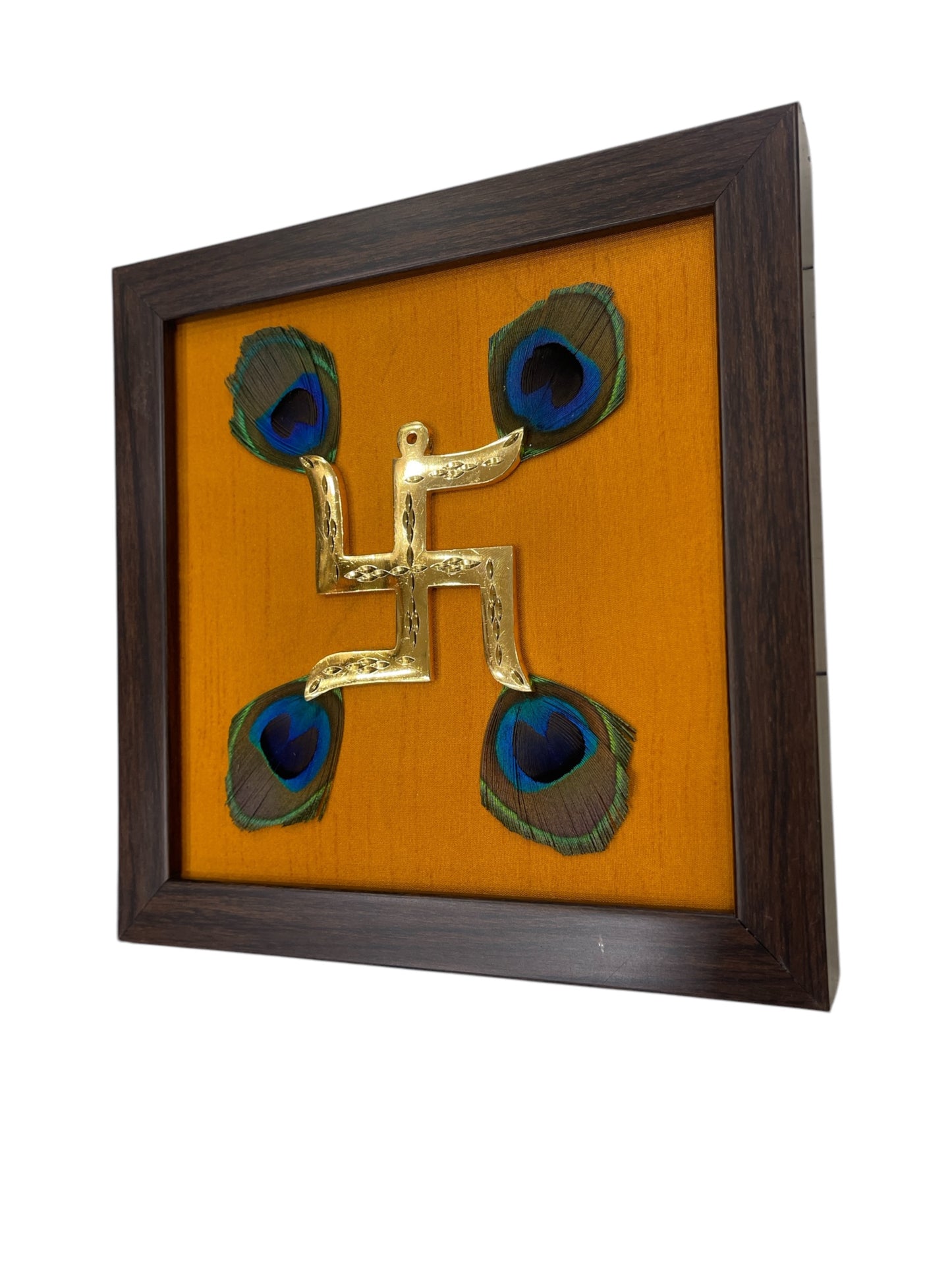 Brass Swastik with Peacock Feathers & Orange Silk in Brown frame