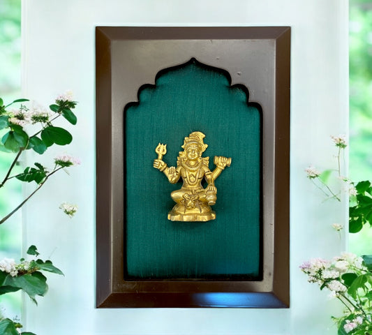 Brass Shiva with green silk in wooden frame