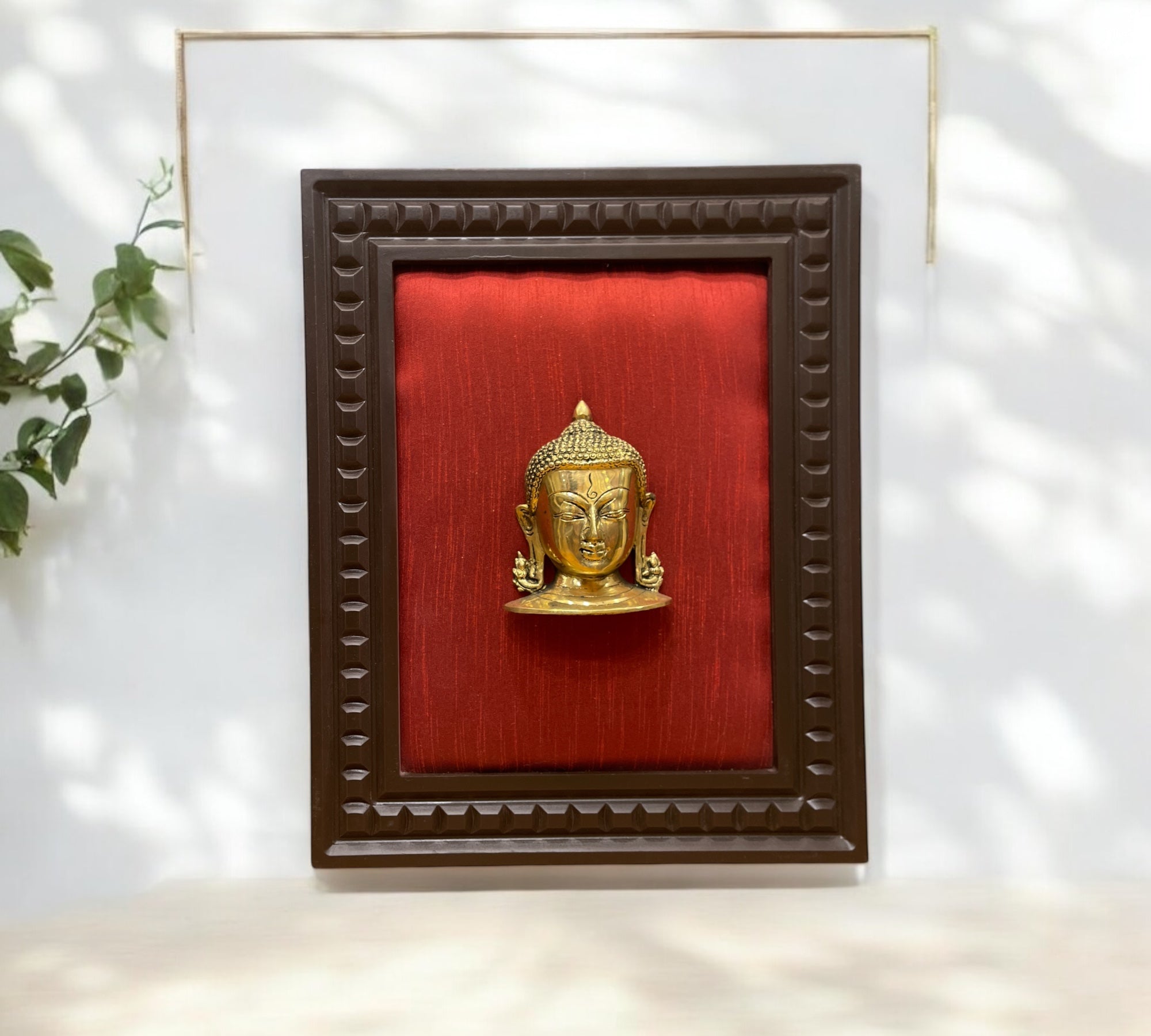 Brass Buddha with wine red silk in wooden frame