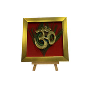Brass Om on Peacock Feather & Red Silk with display stand
