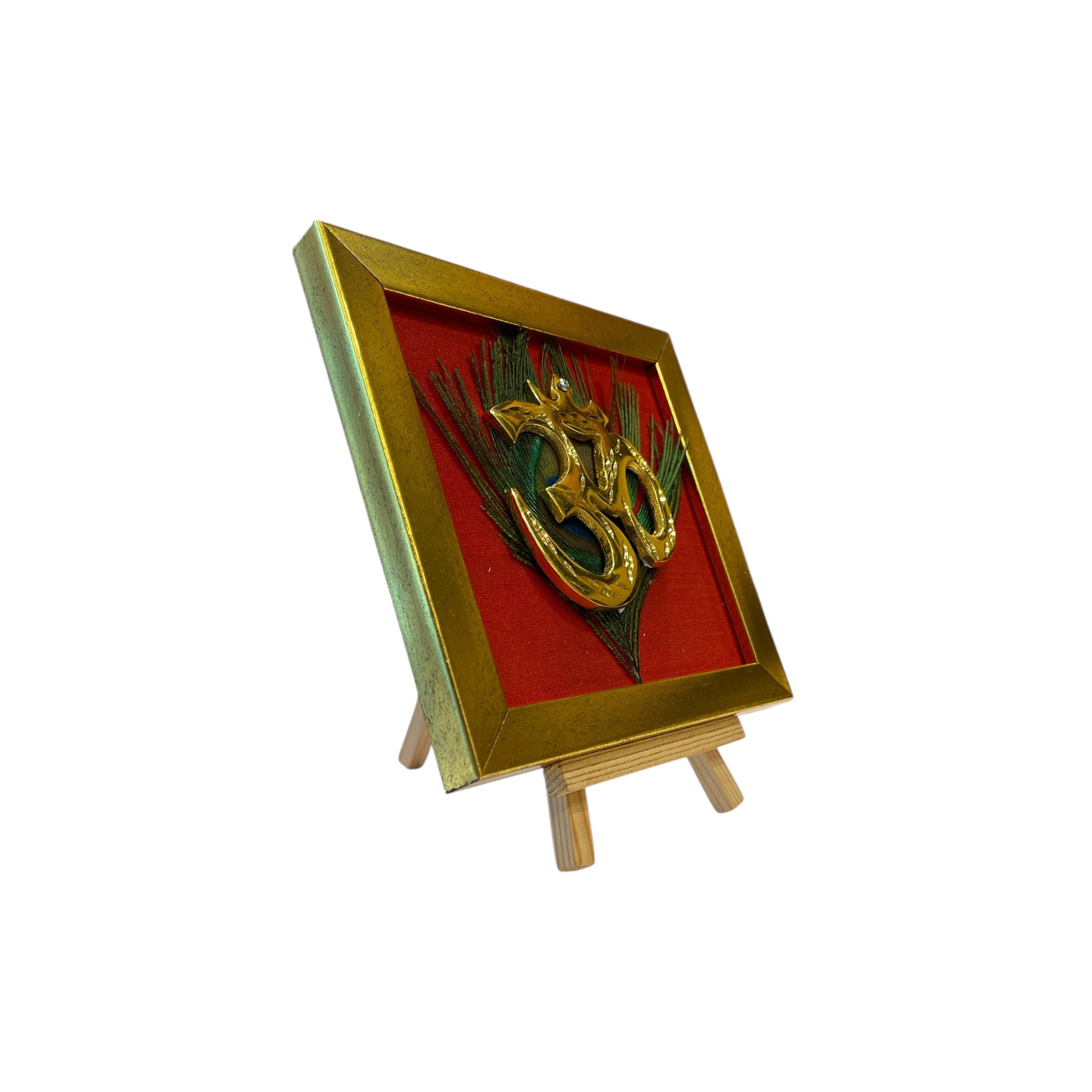 Brass Om on Peacock Feather & Red Silk with display stand