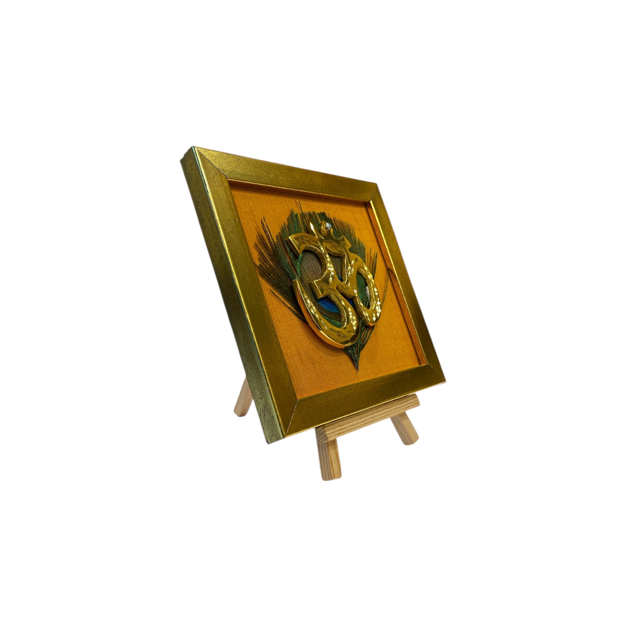 Brass Om on Peacock Feather & Orange Silk with display stand