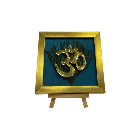 Brass Om on Peacock Feather & Blue Silk with display stand