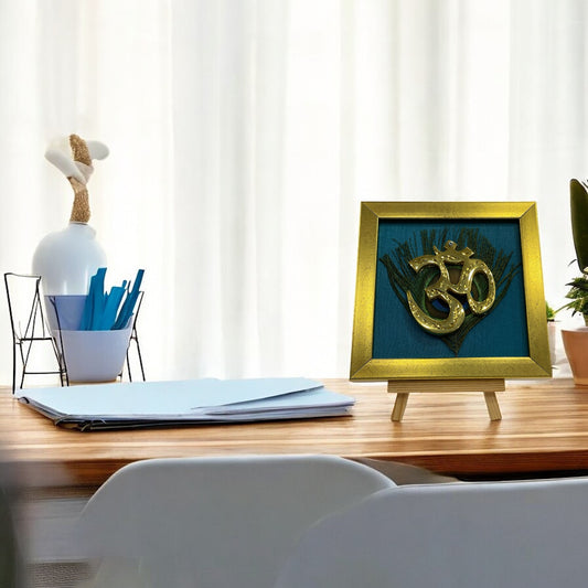 Brass Om on Peacock Feather & Blue Silk with display stand