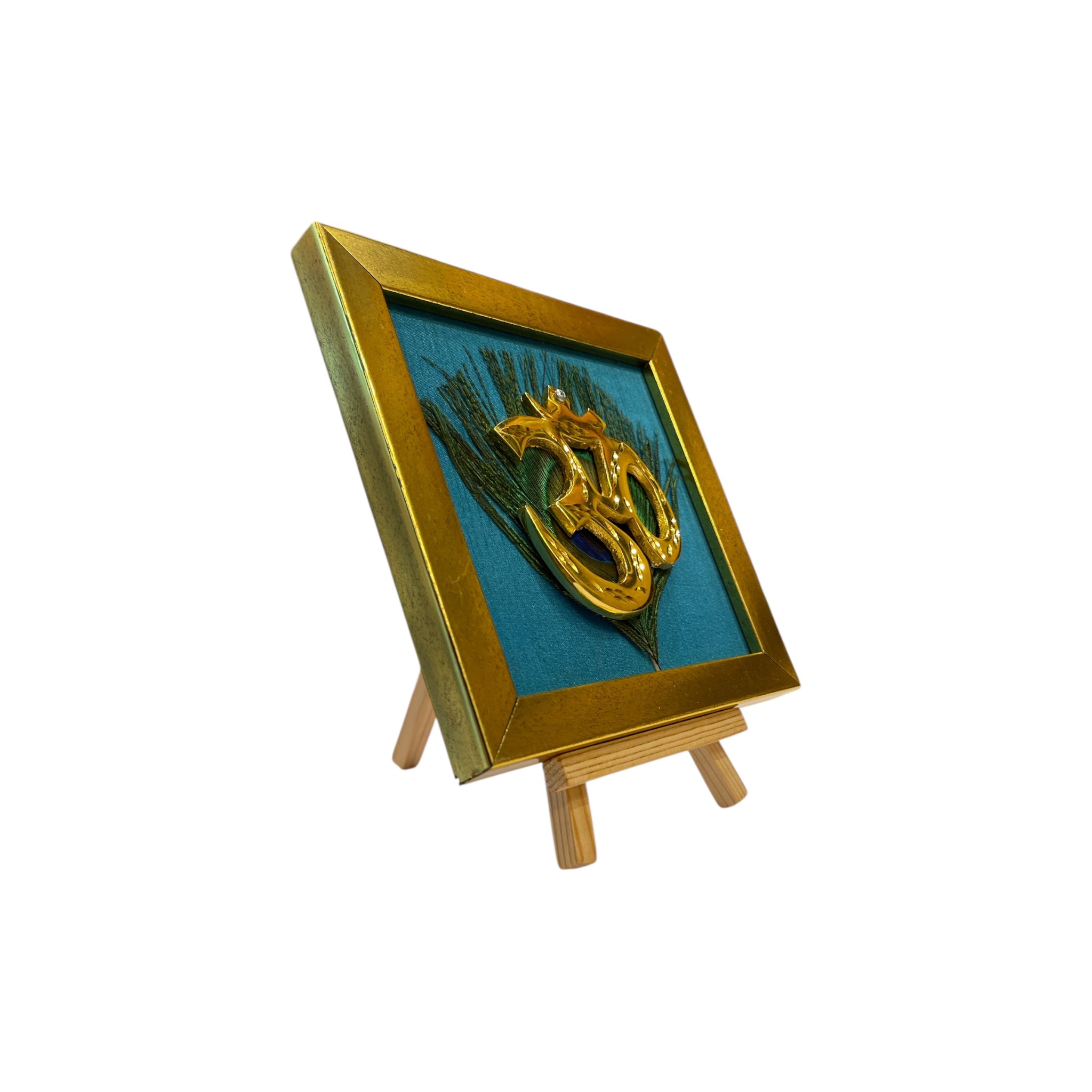 Brass Om on Peacock Feather & Blue Silk with display stand