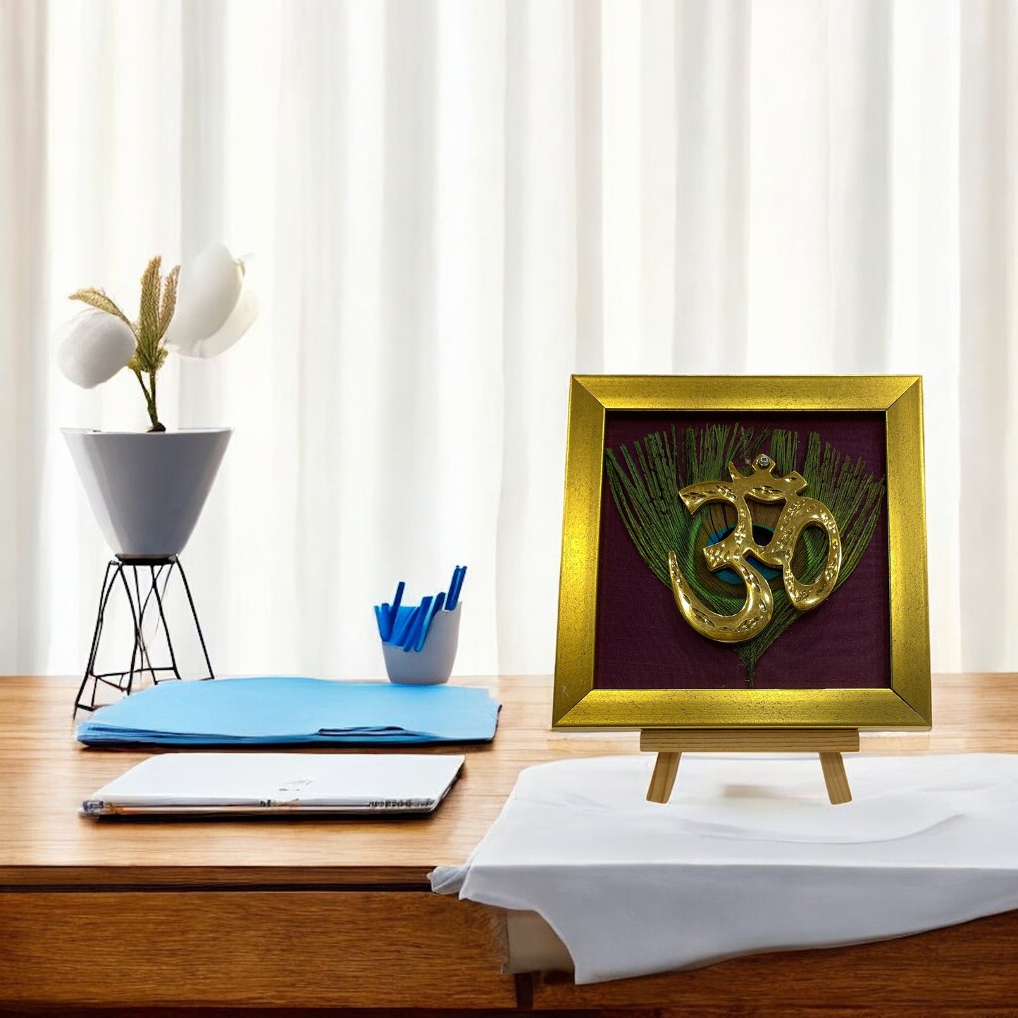 Brass Om on Peacock Feather & Violet Silk with display stand