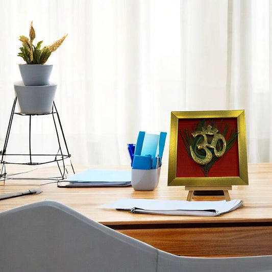 Brass Om on Peacock Feather & Red Silk with display stand