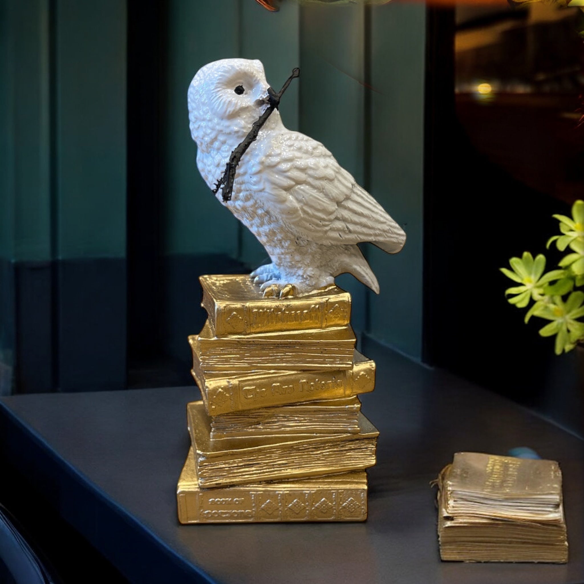 White Owl Figurine on a Stack of Golden Books