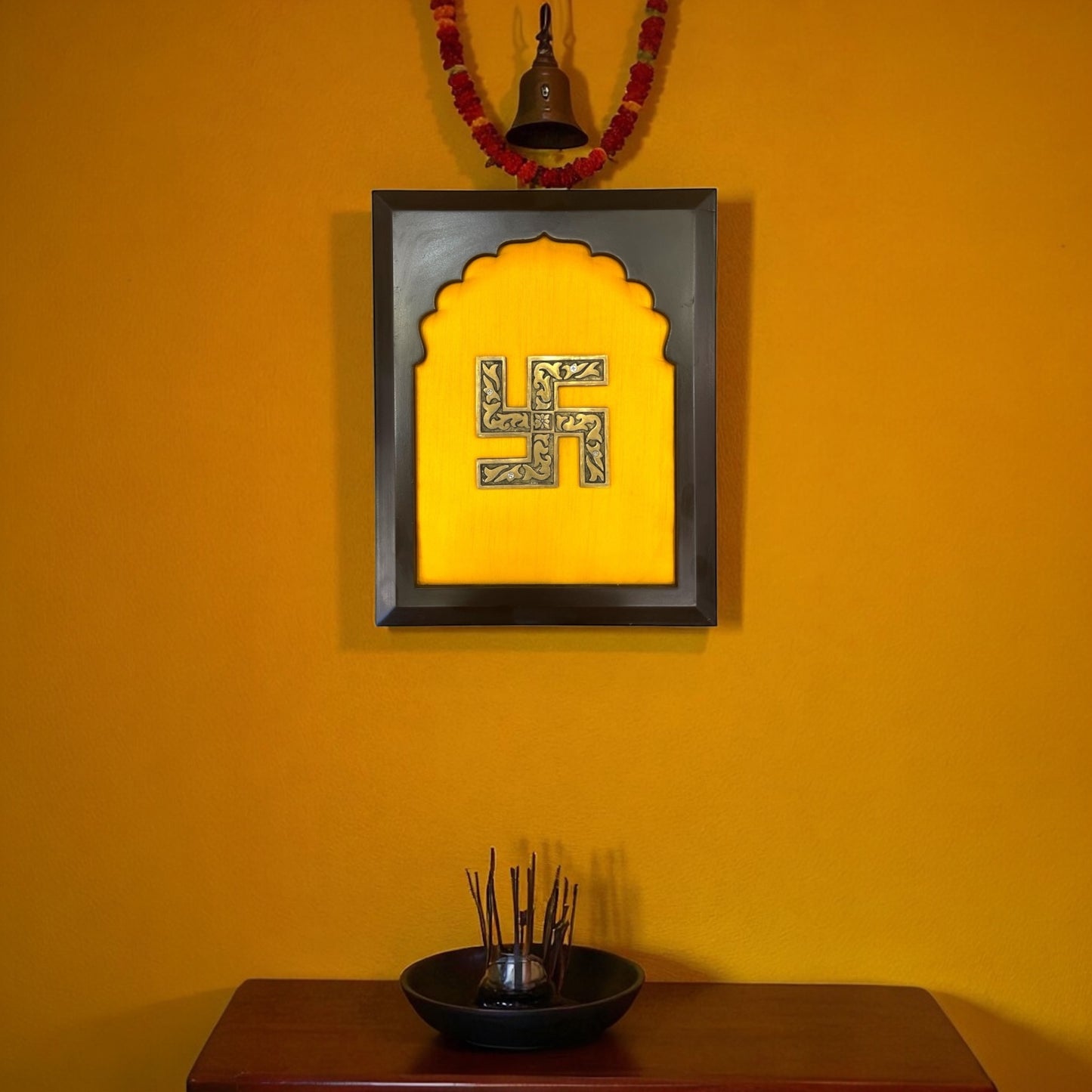 Brass Swastik on Golden Silk in Wooden frame