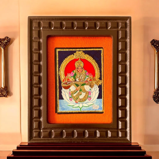 Goddess Saraswati on White Lotus Tanjore Painting – Red, Indigo Blue, Rama Green, White & Orange