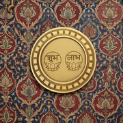 Shubh Labh Golden circular frame with beige backdrop