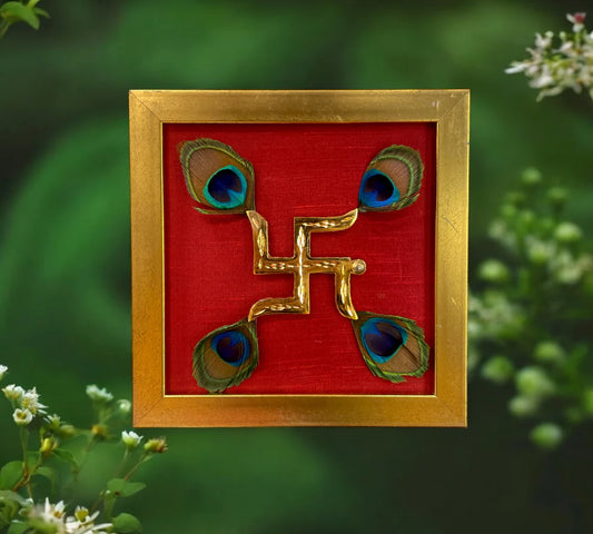Brass Swastik with peacock feather & wine red silk in Gold frame