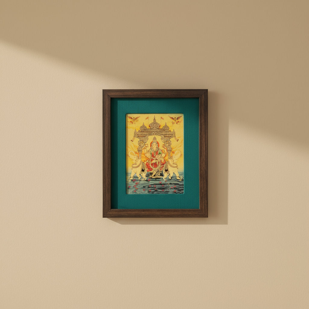 Verdant Blessings: Gajalakshmi Devi's Divine Presence in Green Silk With Brown Frame