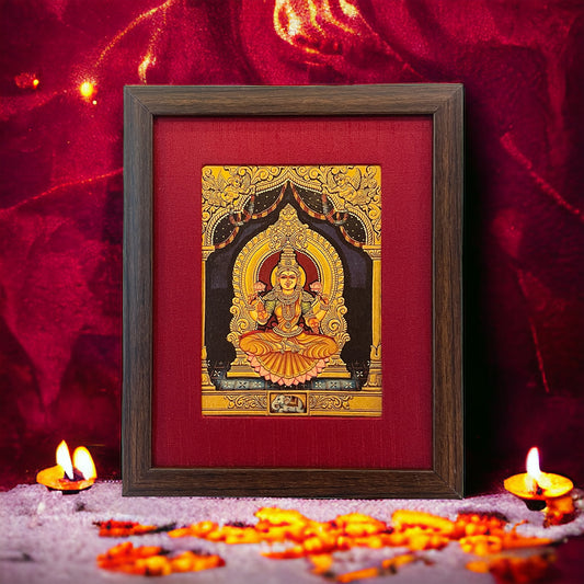 Ruby Radiance: Lakshmi Devi's Divine Presence in Red Silk With Brown Frame