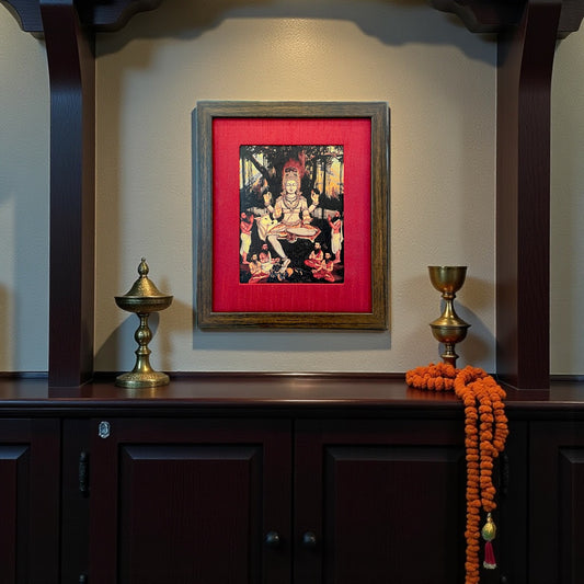 Sacred Wisdom Unveiled: God Dakshinamurthy Presence in Red Silk With Brown Frame