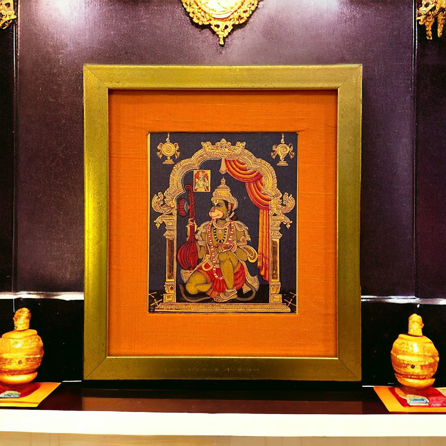 "Divine Harmony: Hanuman Veena Artwork - Gold Leaf, Orange Silk Mount, Gold Frame"