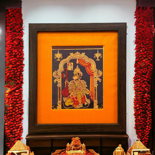 "Divine Grace" : Gold Leaf Printed Hanuman in orange silk with brown frame