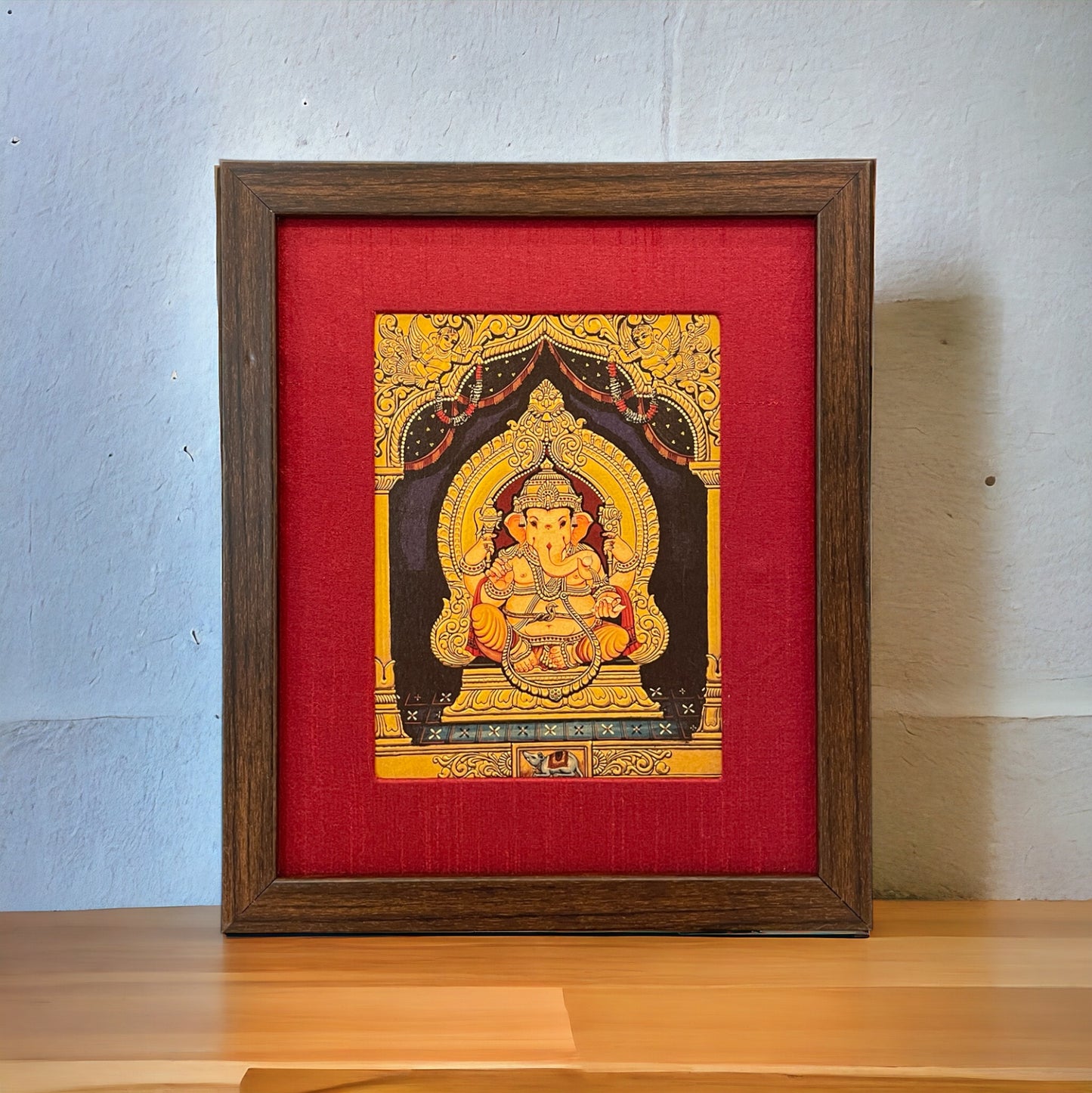 Shree Ganesha's Divine Presence with  Red Silk With Brown Frame