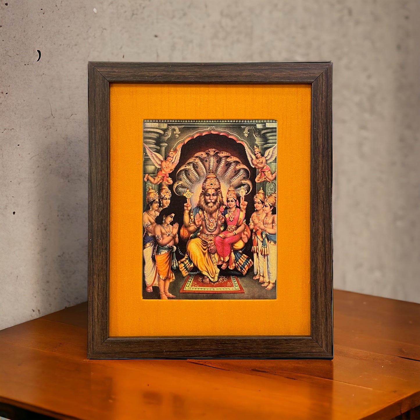 Sacred Harmony: God Lakshmi Narasimha Swamy in Orange Silk With Brown Frame