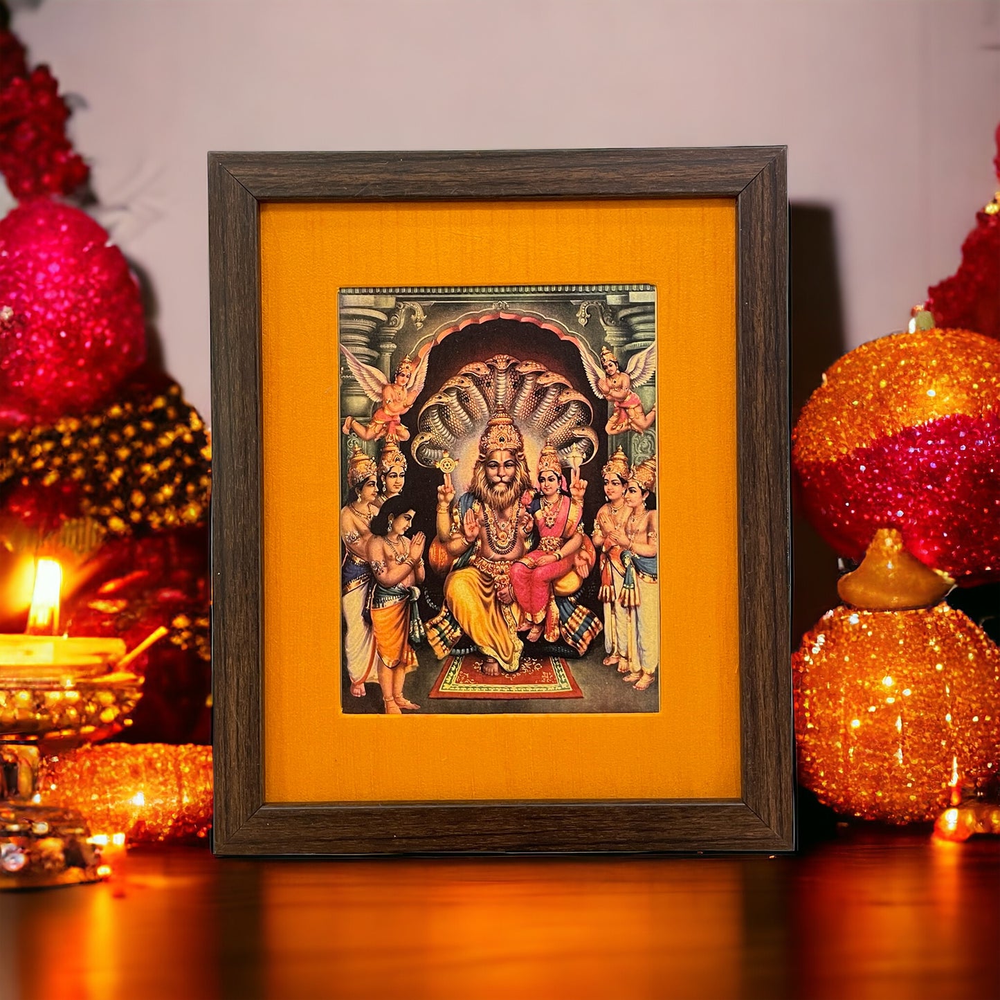 Sacred Harmony: God Lakshmi Narasimha Swamy in Orange Silk With Brown Frame