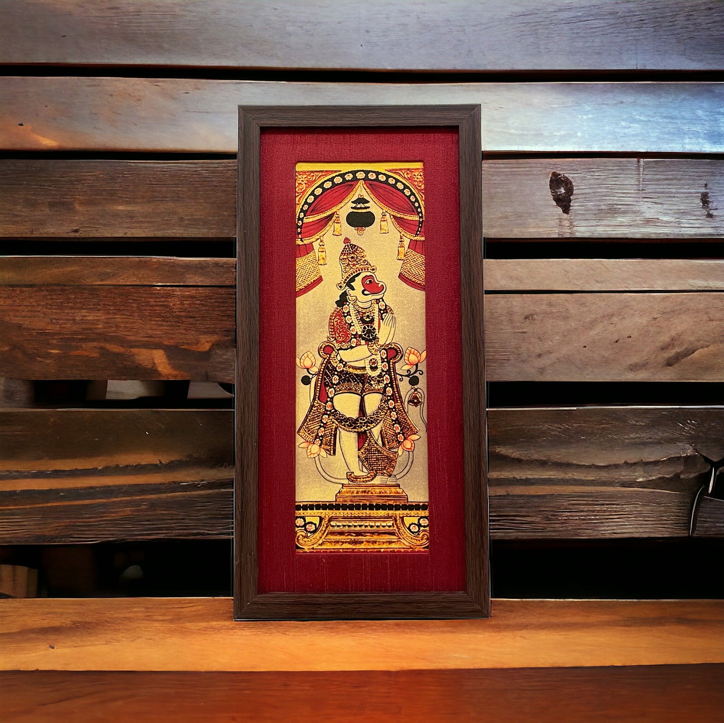 Harmony of Divinity: Lord Hanuman Artistry in Red Silk With Brown Frame