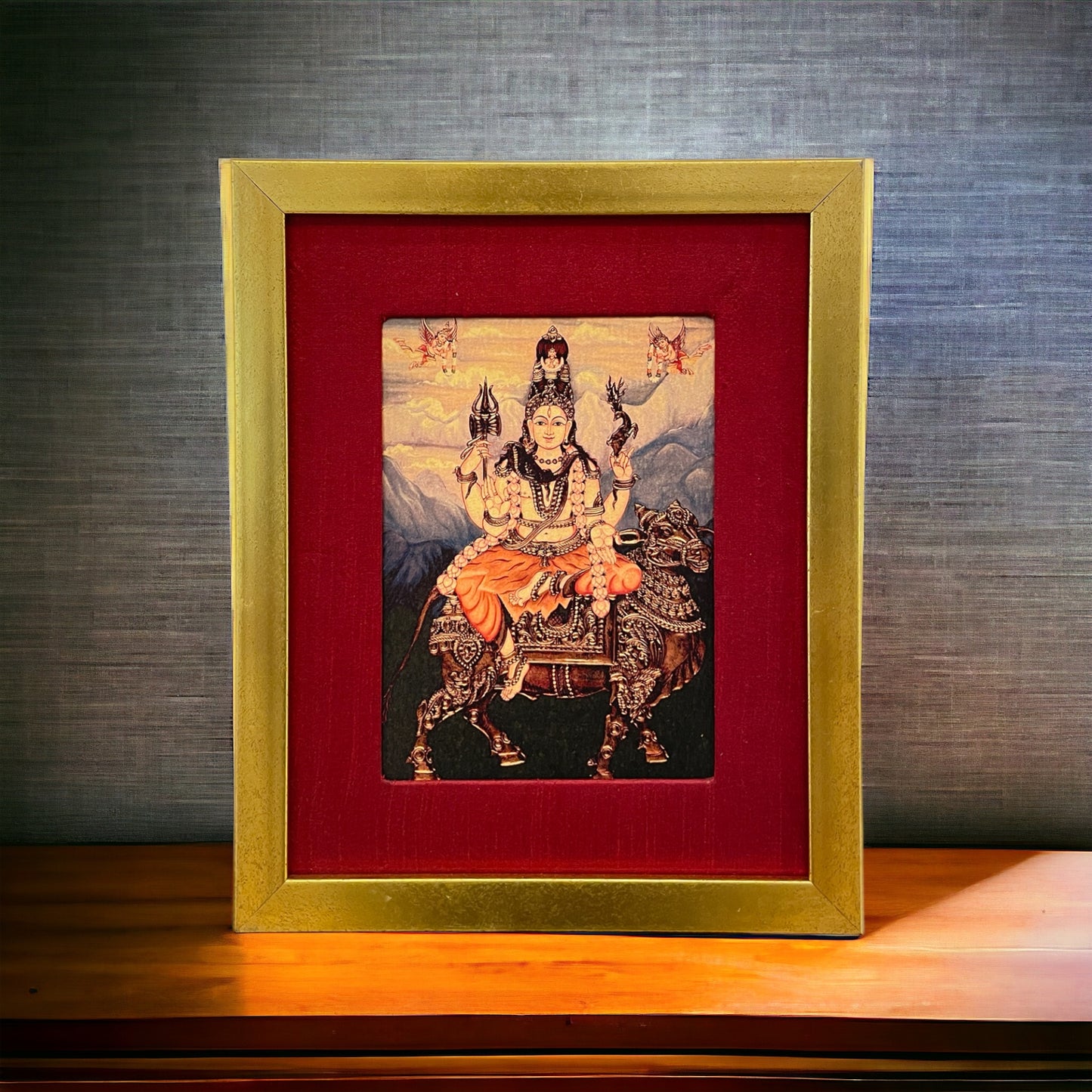 Divine Harmony: Shiva on Nandi in Resplendent Red Silk with Gold Frame