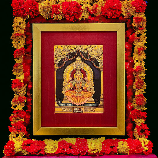 Radiant Elegance: Lakshmi Devi's Divine Presence in Red Silk with Gold Frame
