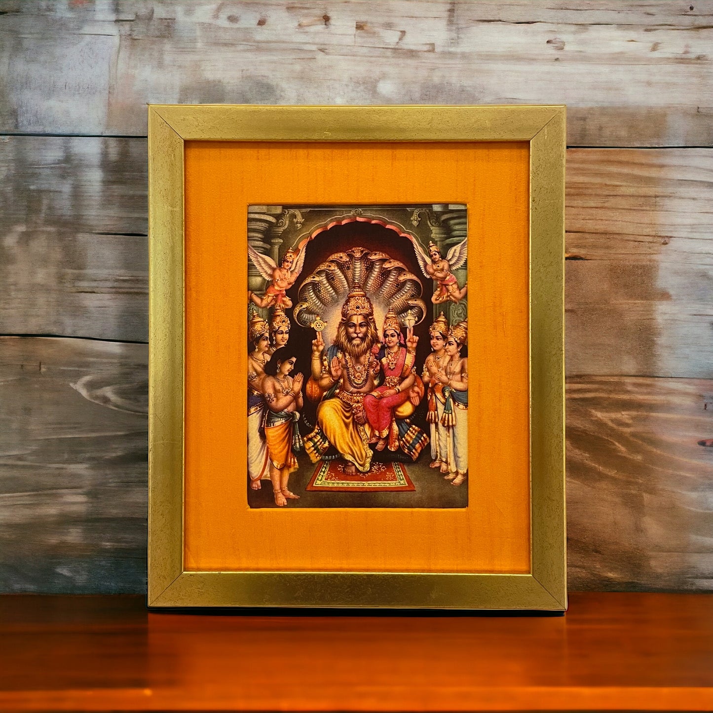 Sacred Harmony: God Lakshmi Narasimha Swamy in Orange Silk With Gold Frame