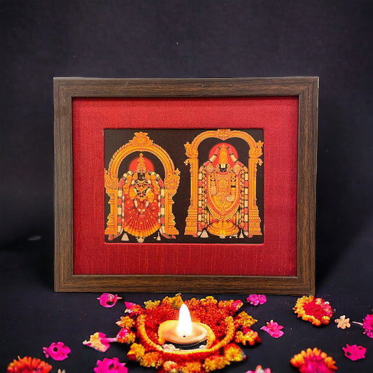 Divine Depiction of God Venkateswara and Goddess Padmavathi in Red Silk Ensemble With Brown Frame